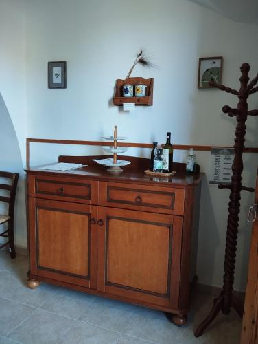 a wooden cabinet with a sink in a room at Agriturismo Podere Montenero in Alberese