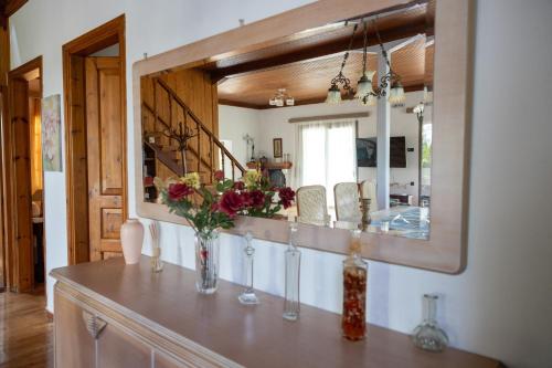 a mirror on top of a dresser in a room at Gyra Villas - Villa Ermis with private pool in Lefkada
