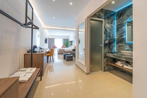 a bathroom with a large stone fireplace in a room at Philia Center Suites in Rhodes Town