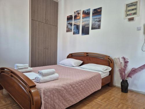 a bedroom with a bed with towels on it at Urban Roof Studio in Kavala