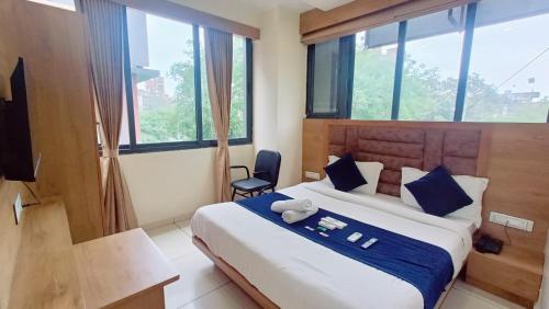 Postel nebo postele na pokoji v ubytování Hotel Suncity