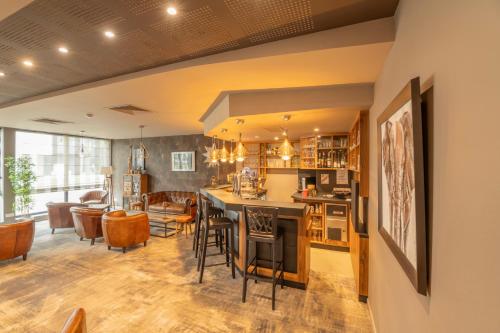 Χώρος καθιστικού στο Le Lodge Brit Hotel Strasbourg Zenith