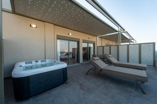 a large room with a hot tub on a building at Philia Center Suites in Rhodes Town