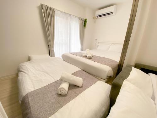 En eller flere senge i et værelse på GLITTER101 Max 5ppl 5 minutes to USJ by train