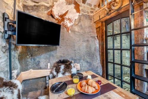 a room with a table with a plate of food on it at Woolcombers in Addingham