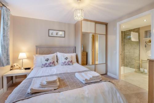 Ένα ή περισσότερα κρεβάτια σε δωμάτιο στο Rose Bank Cottage