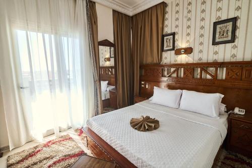 Postel nebo postele na pokoji v ubytování Teba Hotel Ras Elbar