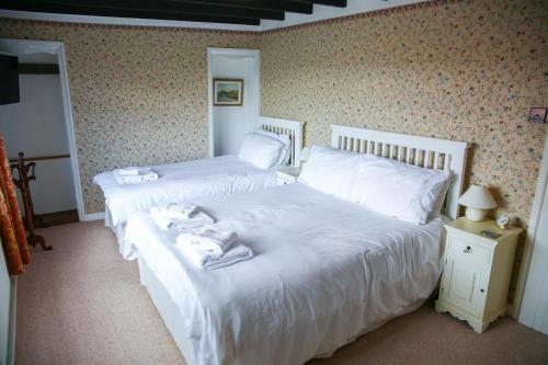 Voodi või voodid majutusasutuse Ness Cottage toas