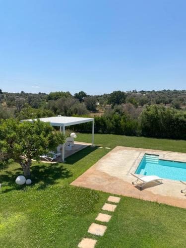 an image of a backyard with a swimming pool at white moon holiday home in Ostuni