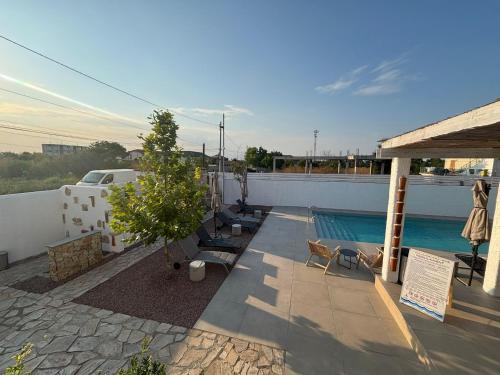 a patio with a swimming pool on top of a house at Vila Alaris Vama Veche in Vama Veche