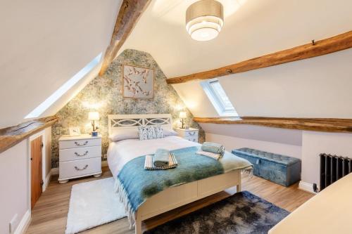 a bedroom with a bed in a attic at Red Briar House in Danby