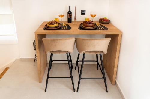 a small table with two chairs and wine glasses at NEW! Oldie but goldie in Split