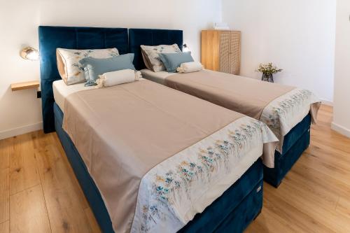 two beds sitting next to each other in a room at NEW! Oldie but goldie in Split