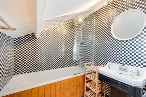 a bathroom with a sink and a mirror at Hillside in Robin Hood's Bay