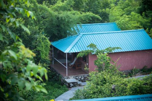 an overhead view of a house with a blue roof at The Sky Imperial Jungle Camp Resort in Kumbhalgarh