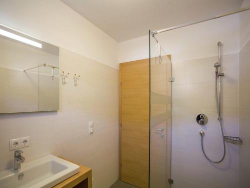 a bathroom with a shower and a sink at Modern Apartment near Ski Area in Brixen im Thale in Feuring