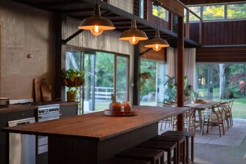 a large kitchen with a large wooden table and chairs at Linden Rose Barn in Montville