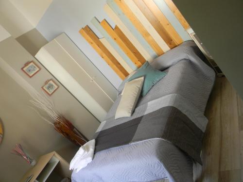 a bedroom with a bed with pillows on it at B&B Melanella in Capaccio-Paestum