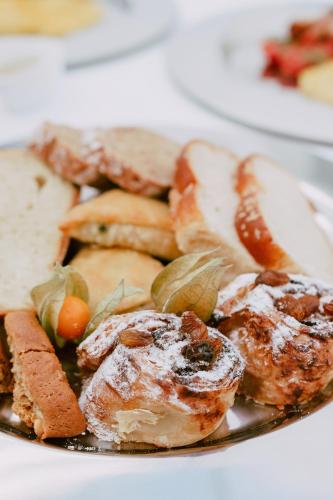 a plate of food with meat and vegetables on it at The Summit Escape House in Achílleion
