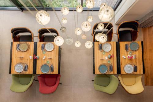 a room with chairs and clocks on the wall at Kaan Casablanca in Casablanca