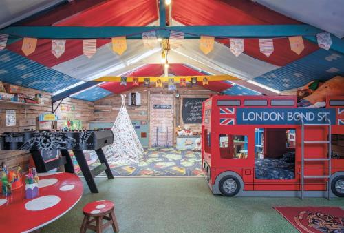 a room with a double decker bus in a house at Piggy in Pembroke
