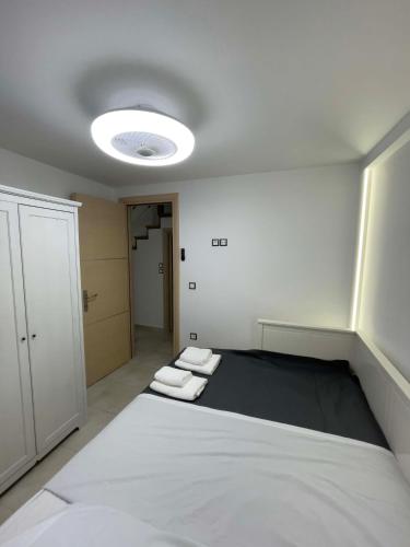 a room with a bed with two towels on it at Casa Maria-Anneta in Kalyves Poligirou