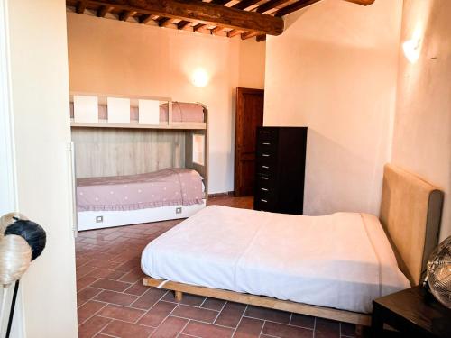 Postel nebo postele na pokoji v ubytování La Casetta