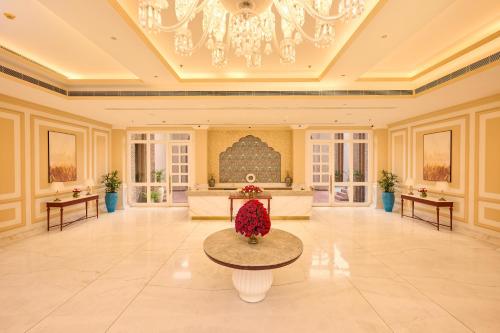 a large lobby with a couch and a table at Sarovar Premiere Amritsar in Amritsar