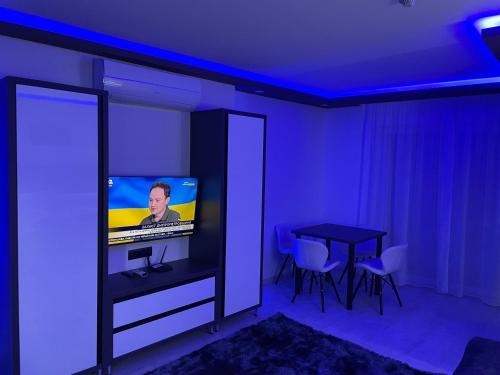 TV a/nebo společenská místnost v ubytování Hotel Pálma
