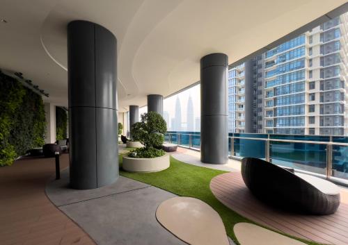 a lobby with a view of a building at Eaton Residences KLCC - Luxury Apartment in Kuala Lumpur