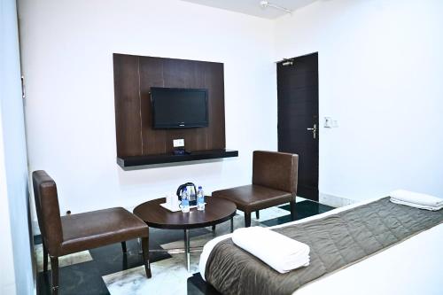 Ένα ή περισσότερα κρεβάτια σε δωμάτιο στο Hotel Good Palace Karol Bagh