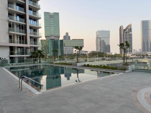 a swimming pool in the middle of a city at Furnished 3BR Maryah Vista Near Cleveland by Central Stay in Abu Dhabi