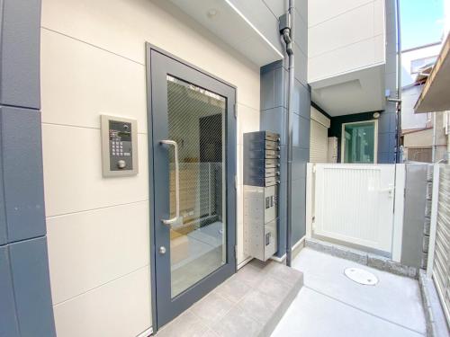 a glass door on a building at GLITTER202 Max 6ppl 5 minutes to USJ by train in Osaka