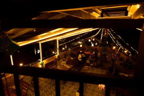 a view of a restaurant at night with lights at Green View Peak Restaurant in Gampola