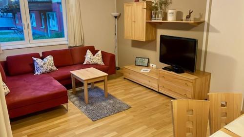 Μια τηλεόραση ή/και κέντρο ψυχαγωγίας στο Appartements "ALPS" by Kamper