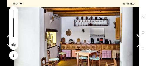 a dining room with a table and chairs at affittacamere b&b l'aurora Montelparo in Montelparo