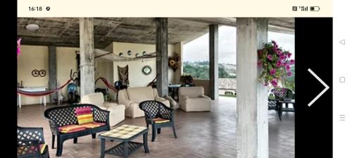 a living room with couches and chairs at affittacamere b&b l'aurora Montelparo in Montelparo