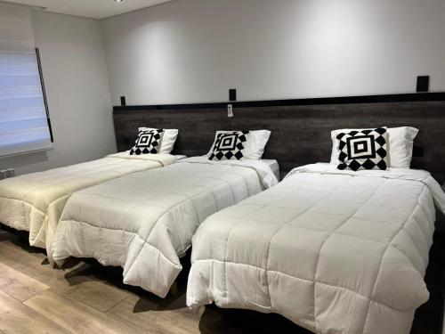 Postel nebo postele na pokoji v ubytování Hotel Alto Center