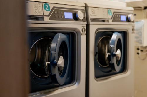 a row of washing machines sitting next to each other at WestCord Hotel Eindhoven in Eindhoven
