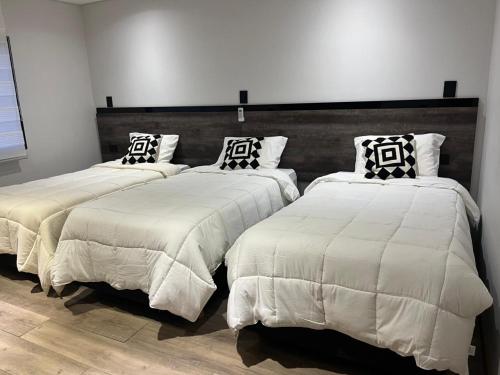 Postel nebo postele na pokoji v ubytování Hotel Alto Center
