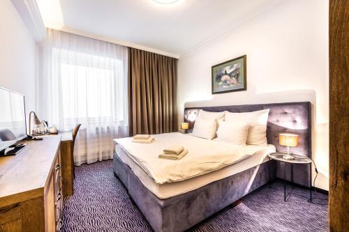 Кровать или кровати в номере Penzion Central