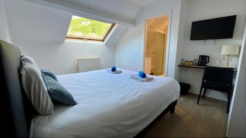 Una cama o camas en una habitación de Hotel LA PLAGE