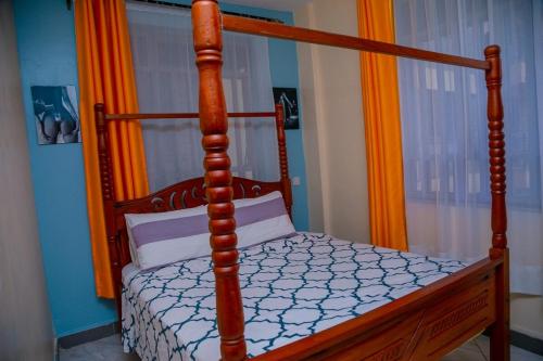 Ένα ή περισσότερα κρεβάτια σε δωμάτιο στο Amazing apartment in Milimani -Kisumu