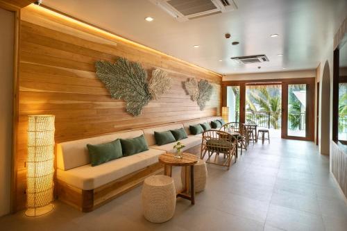 a living room with a couch and a table at Phi Phi at Pier in Phi Phi Don