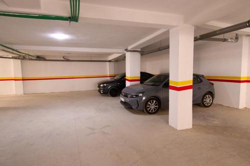 a parking garage with two cars parked in it at La Marina Vivez l'expérience Mehdia à 100m de la plage in Kenitra