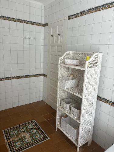 a bathroom with a white shelf in a room at Gorgeous Apartment in Jesús in Nuestra Señora de Jesus