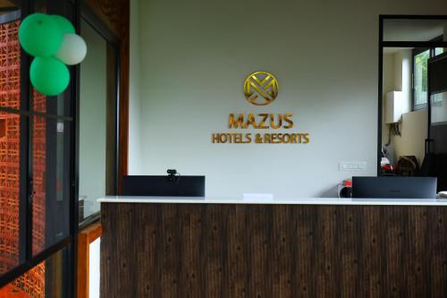 a sign for the marlins sportsagents on a wall at Swiss Holidays in Pinangode