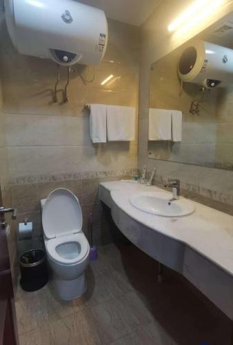 a bathroom with a toilet and a sink at Kohi Afsaron in Dushanbe