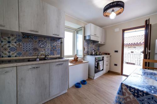 a kitchen with a sink and a counter top at Portico Rodriguez Abatemarco in Abatemarco