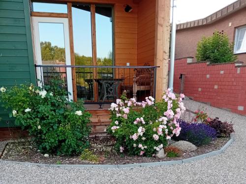 a garden of flowers in front of a house at Ferienhaus am Kuhstall in Bad Münstereifel